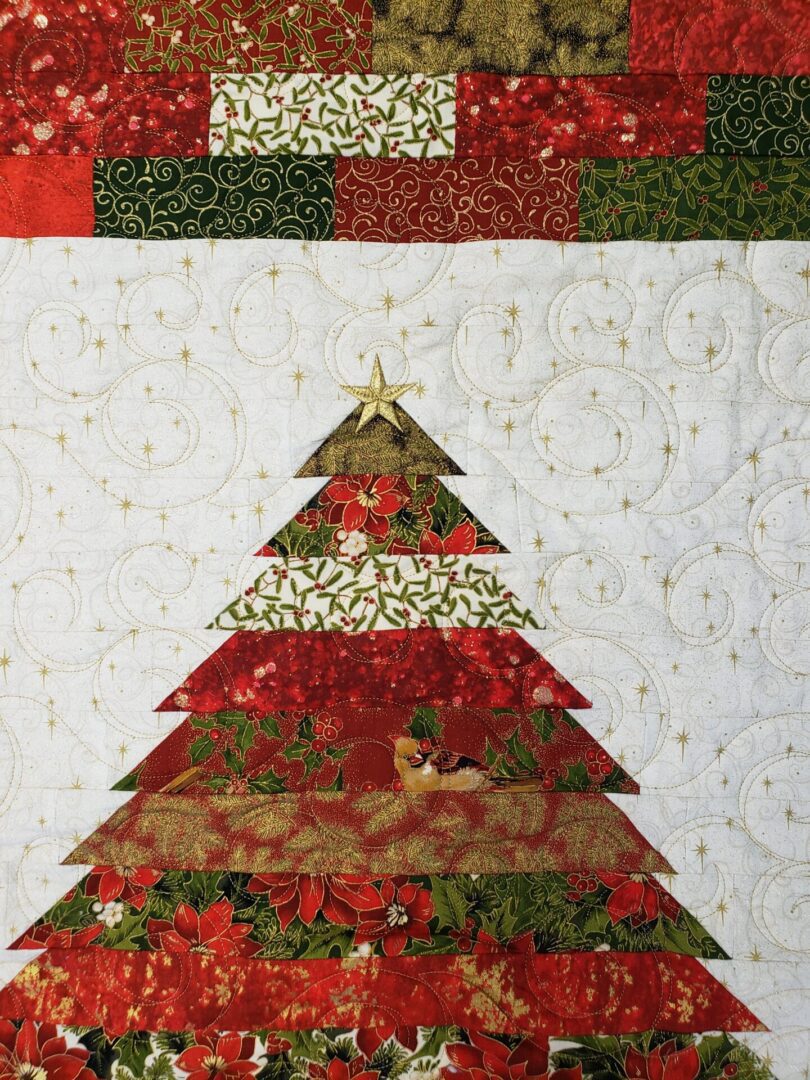 A close up of the christmas tree quilt