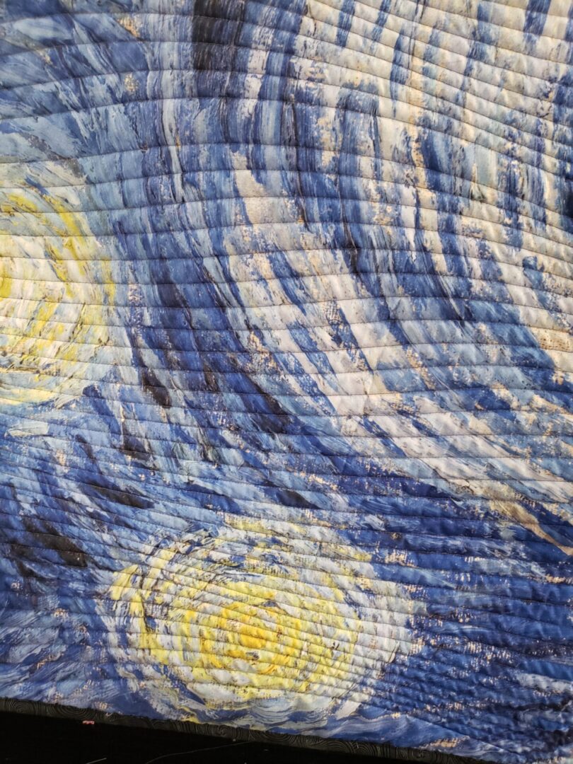 A close up of the fabric in a quilt