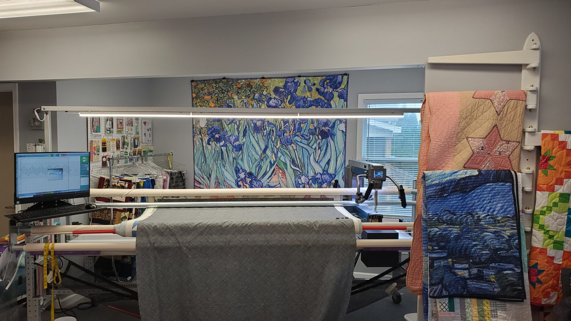A large machine in a room with a painting on the wall.